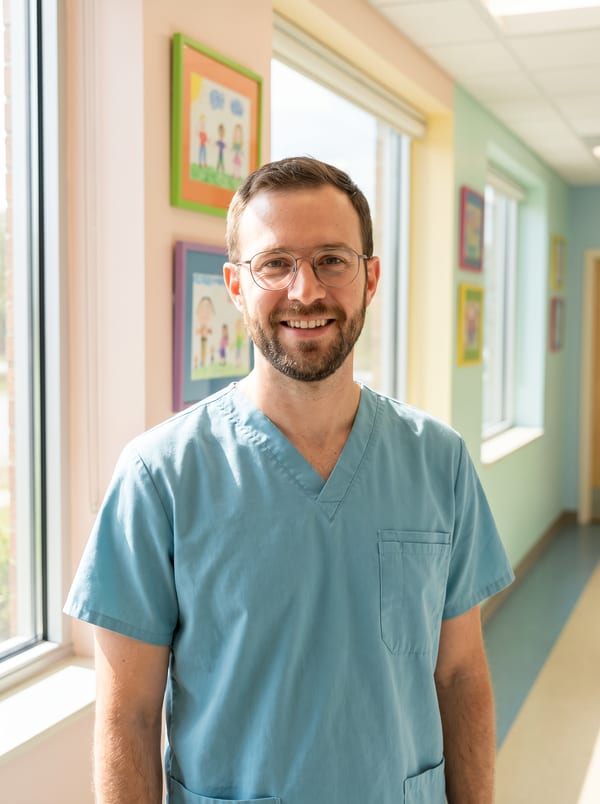Dr. Theo Lindgren in soft teal scrubs